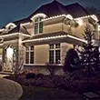 Residential holiday lighting installation on a home